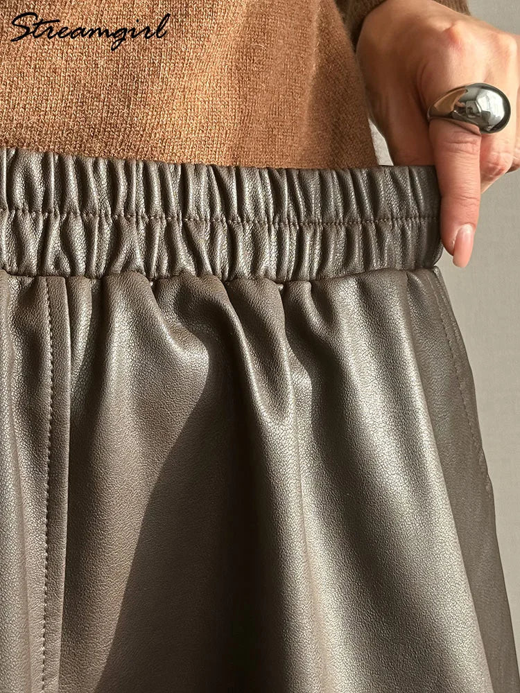 Women's Faux Leather Midi Skirt with Pockets - A-Line Elastic Waist